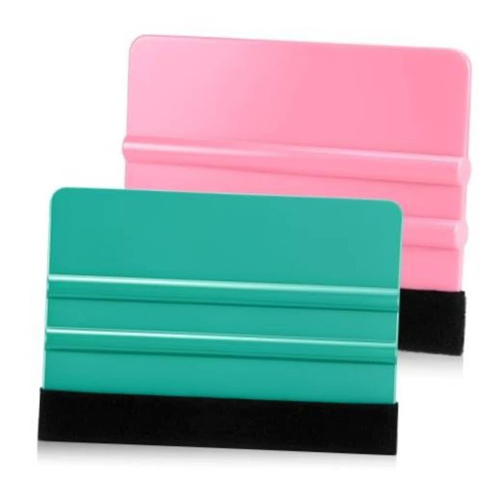 Felt squeegee tool with teal handle and black felt edge, pink backing card shown