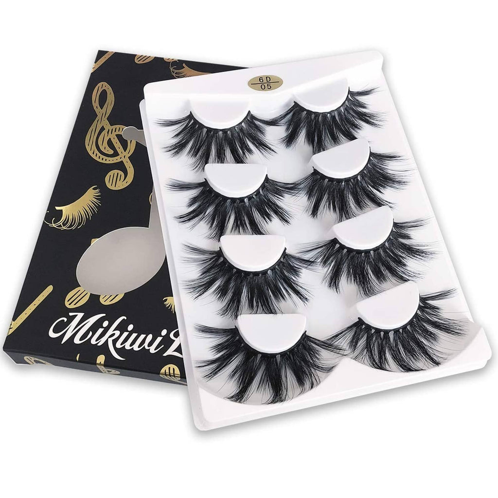 Dramatic faux mink lash strips in white tray, fluffy black wispy volume