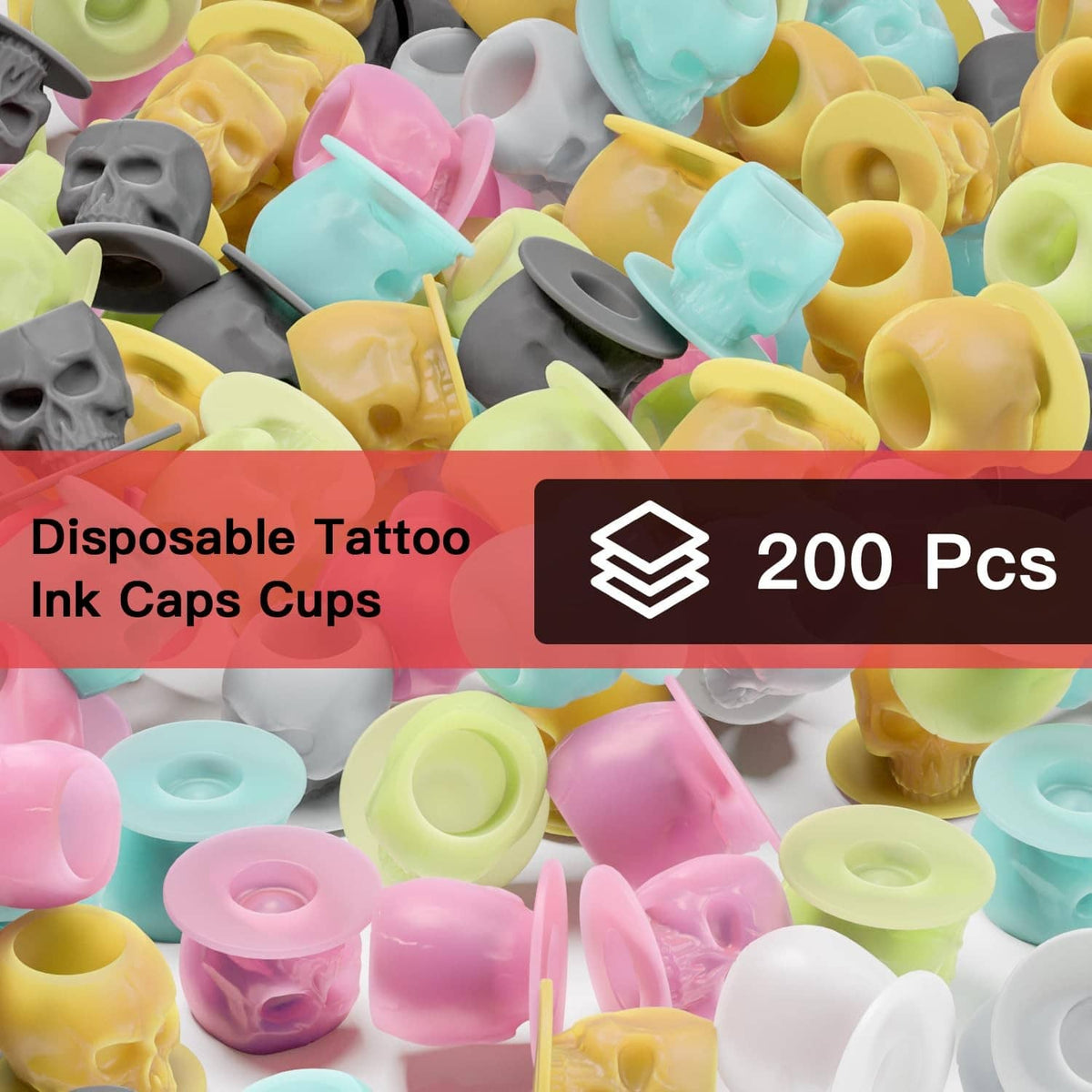 Close-up of mixed-color silicone tattoo ink cups with skull-shaped bases and ink wells.
