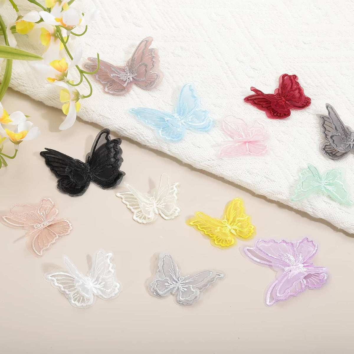 Mixed-color embroidered butterfly appliques, including red, blue, black, and yellow
