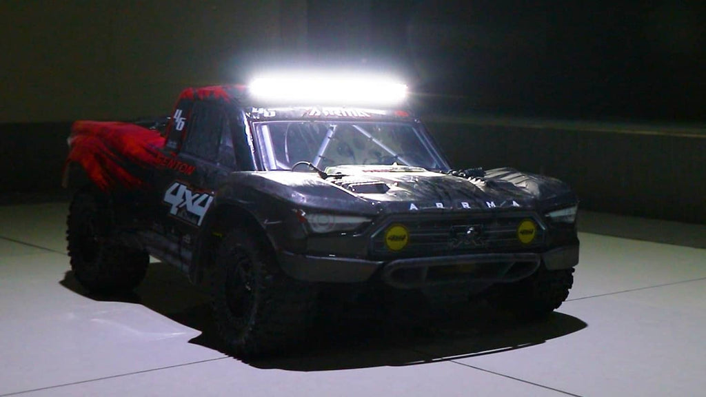 RC truck front with bright white LED light bar illuminated