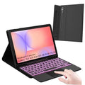 Black tablet keyboard case with 7-color backlit keys, tablet in folio, trackpad visible.