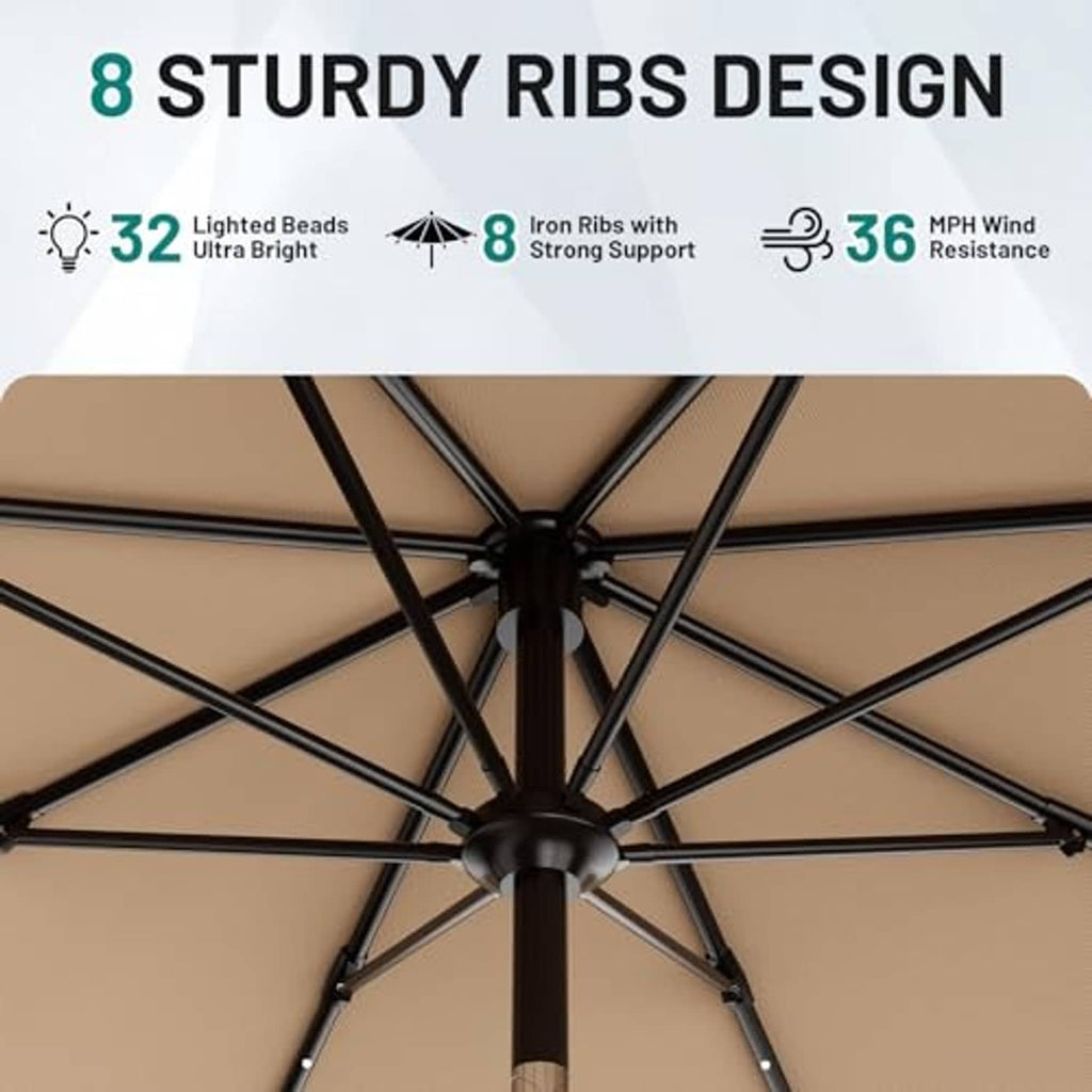 Underside of beige patio umbrella with black ribs and lighted beads