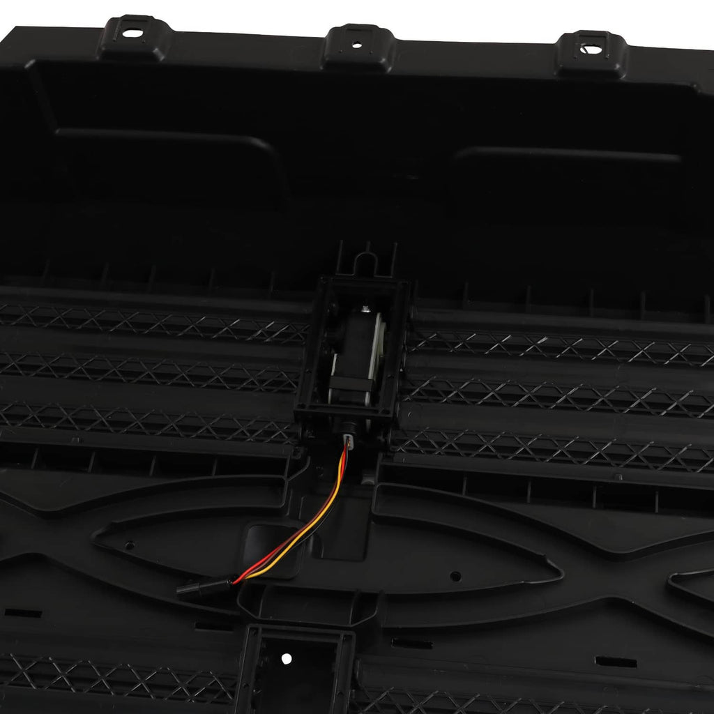 Black grille shutter panel with central actuator housing and orange wire leads
