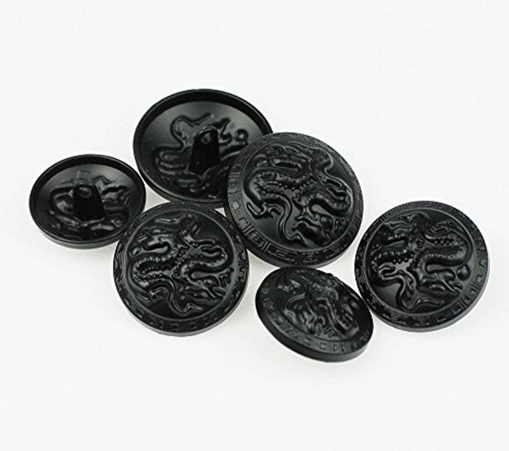 Round metal buttons with embossed dragon relief, dark finish, angled view of set