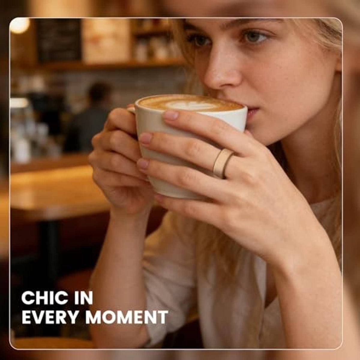 Person holding a cup wearing a light gray ring cover with subtle floral embossing