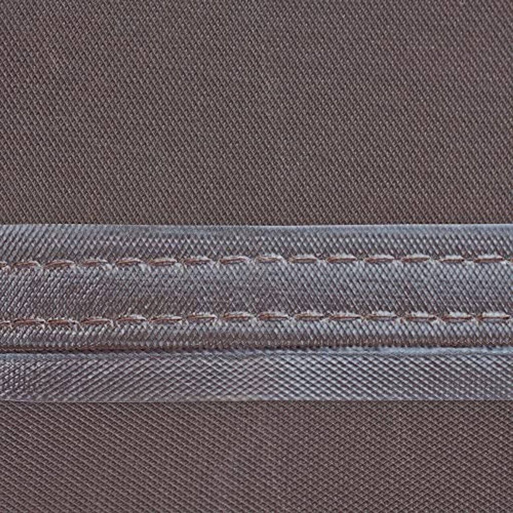 Close-up of waterproof seam tape on brown and beige square AC cover