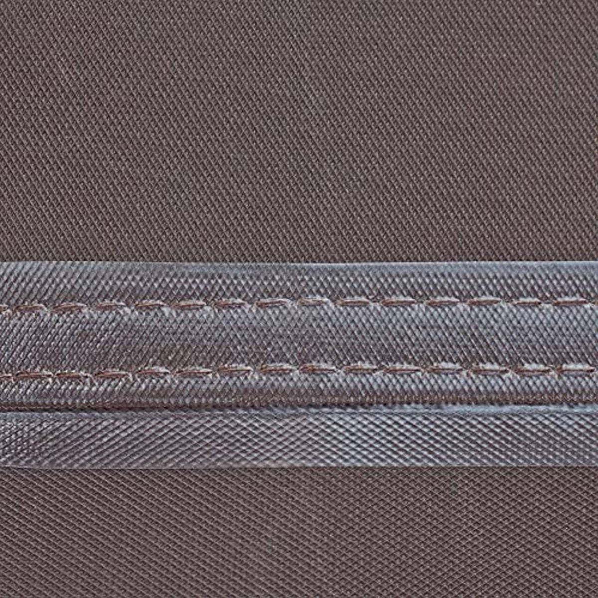 Close-up of waterproof seam tape on brown and beige square AC cover