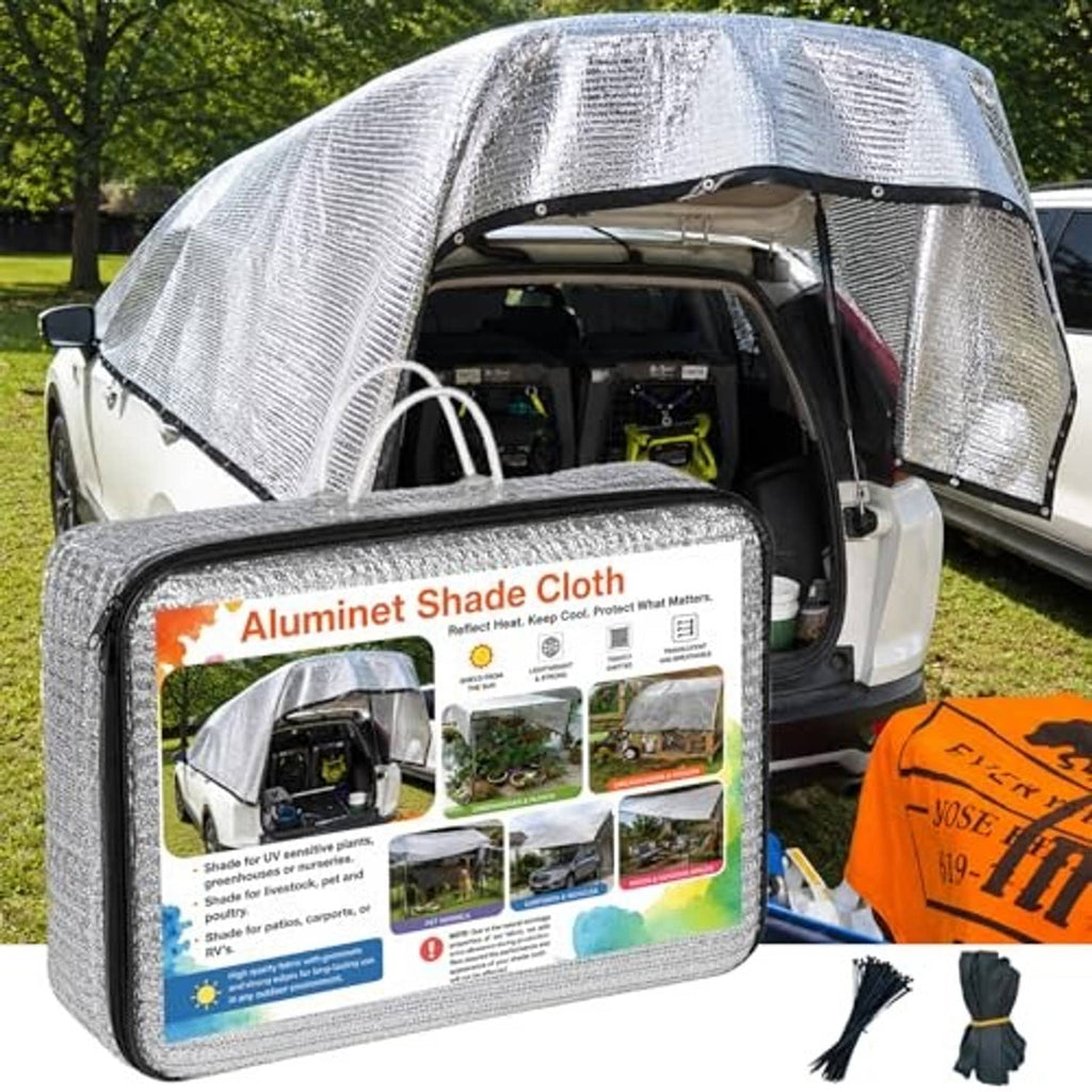 Silver reflective shade cloth vehicle cover with arched top and side openings
