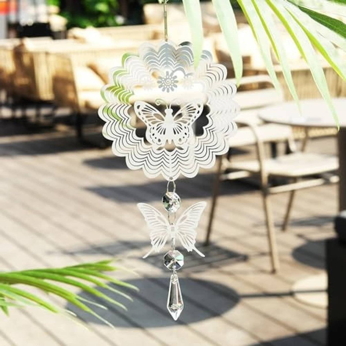 Silver butterfly sun catcher wind spinner with dangling crystal teardrop and beads.