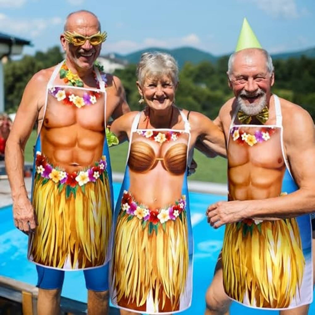 Hawaiian novelty aprons worn on adults: blue torso print, flower garland, yellow grass fringe
