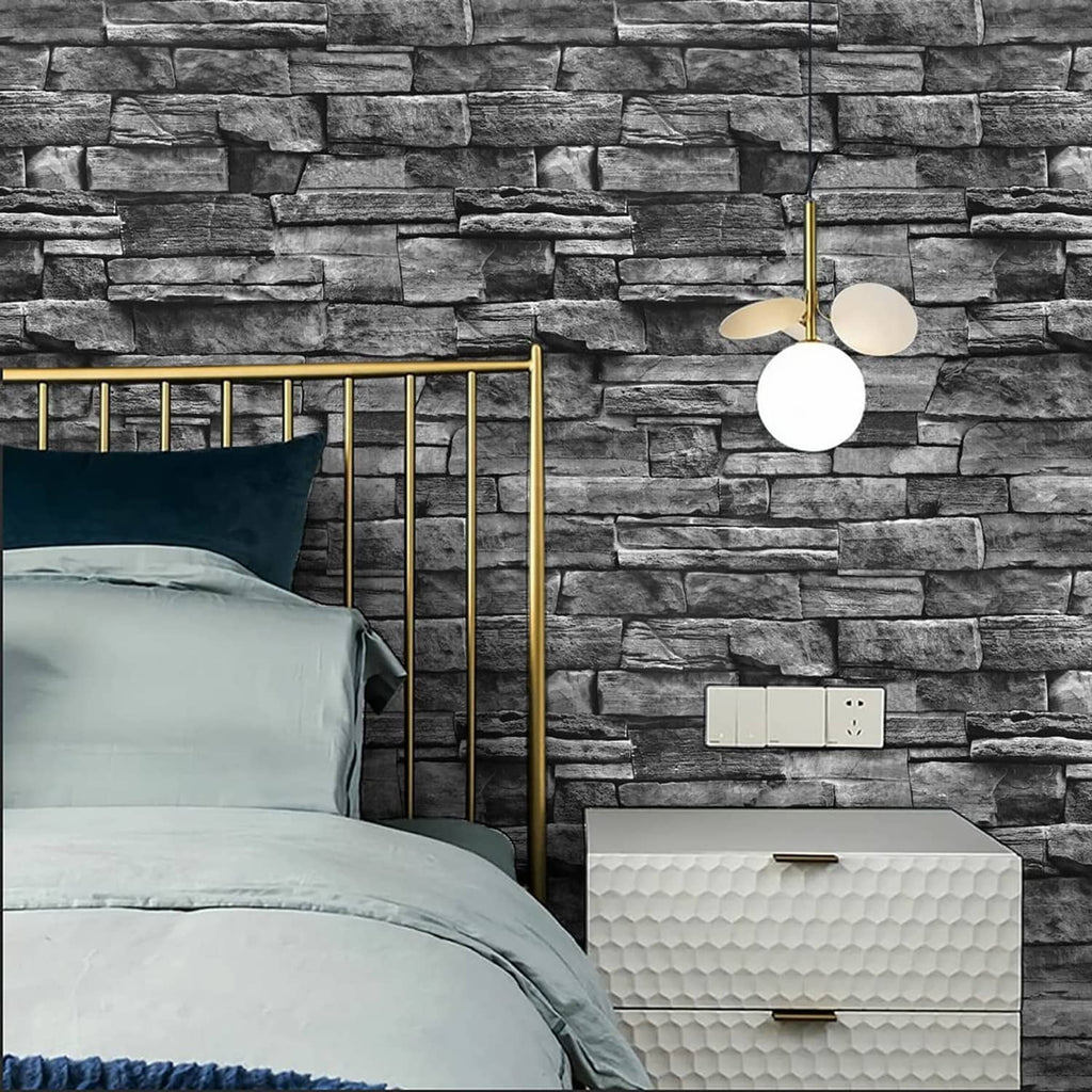 Dark gray brick-pattern wallpaper behind a bed and nightstand area.