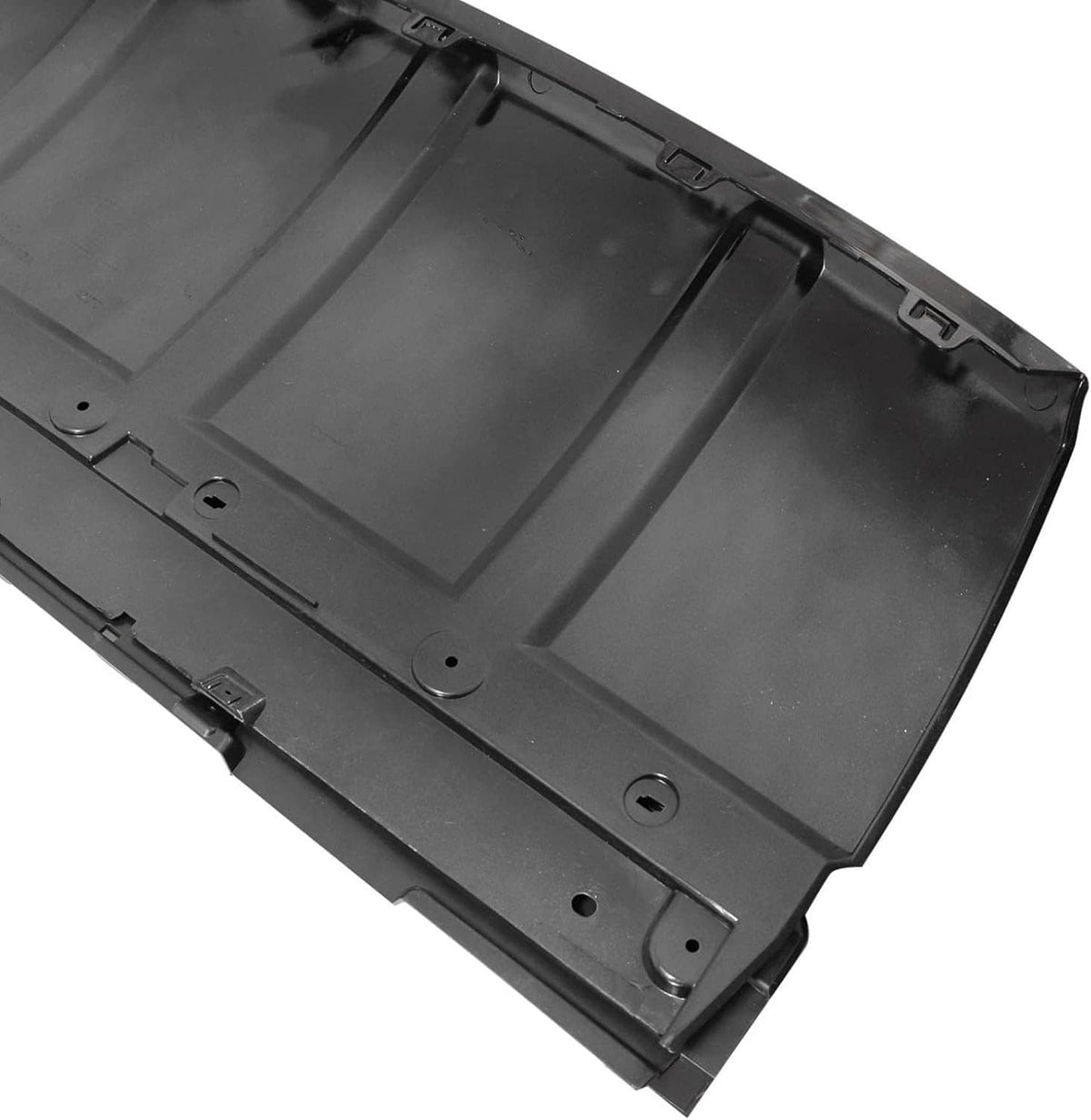 Black underside skid plate trim with circular fastener points and molded ridges