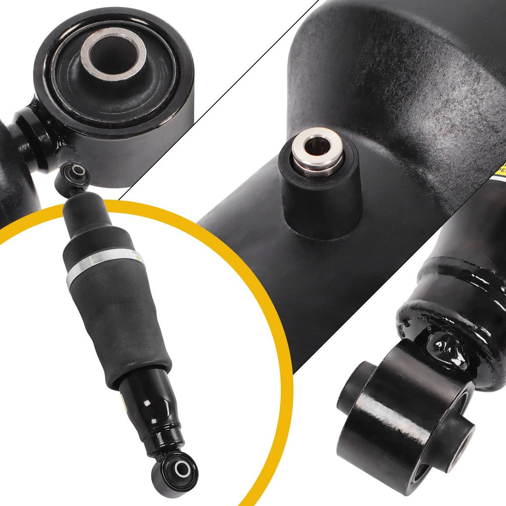 Close-up of rear air shock strut ends and bushings on black suspension strut