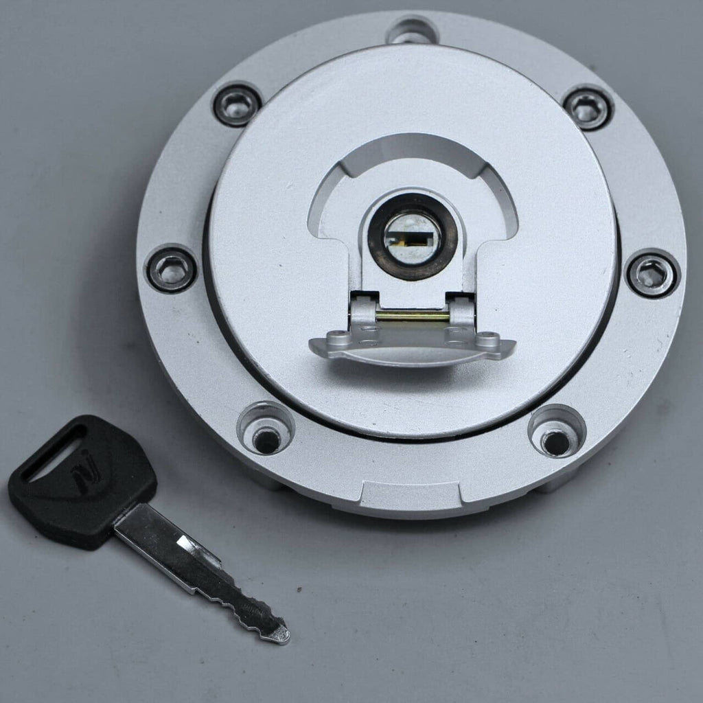 Round silver fuel gas cap with key and lock cylinder, front view