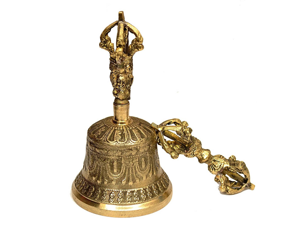 Gold-tone Tibetan meditation bell with ornate handle and engraved base, plus dorje
