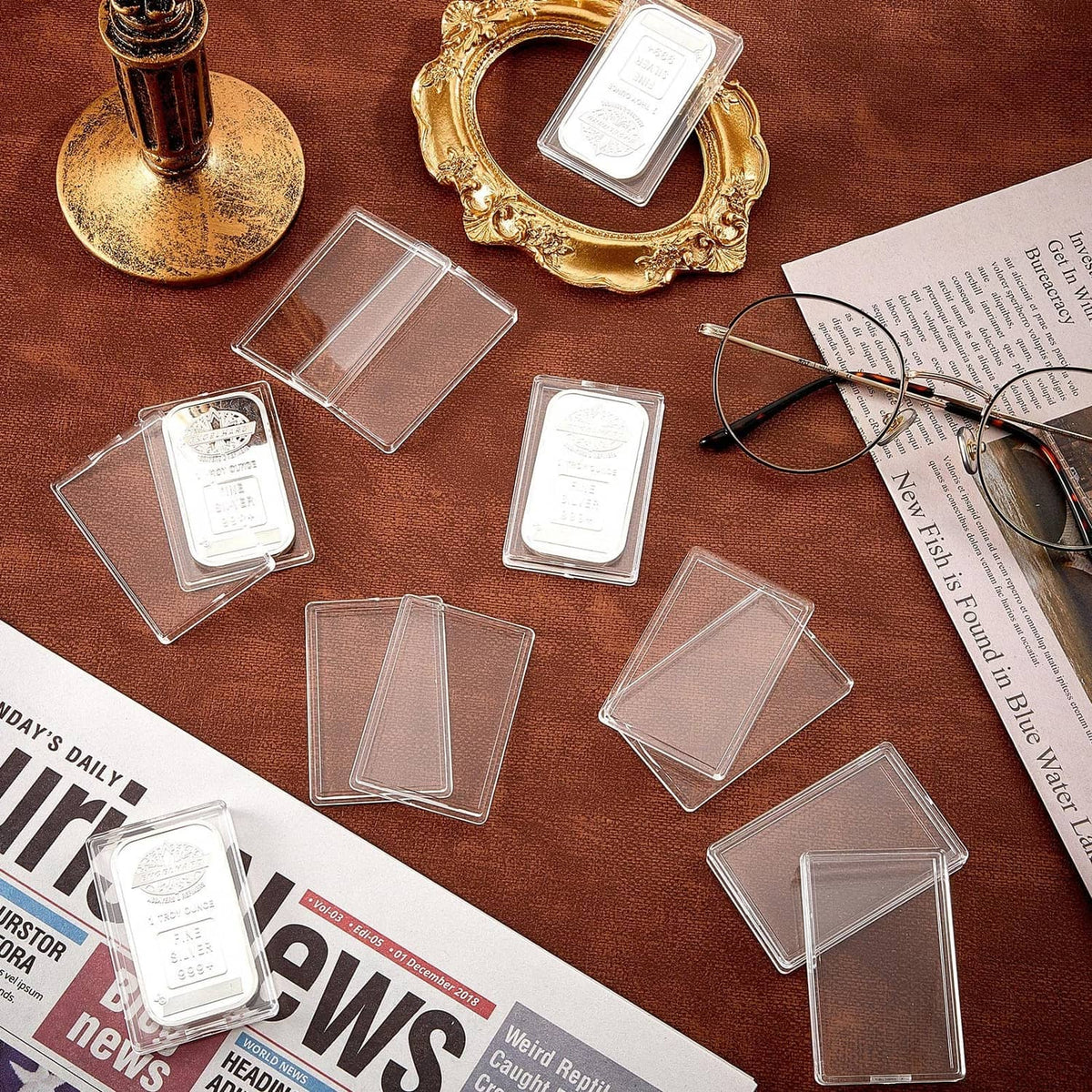 Clear acrylic silver bar holder cases with multiple empty transparent covers