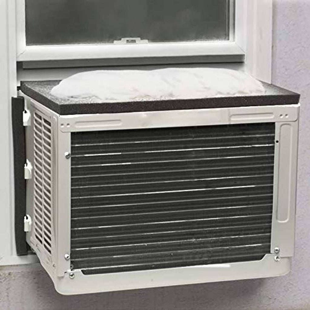 Air conditioner drip cushion on window AC unit with dark gray/black top pad