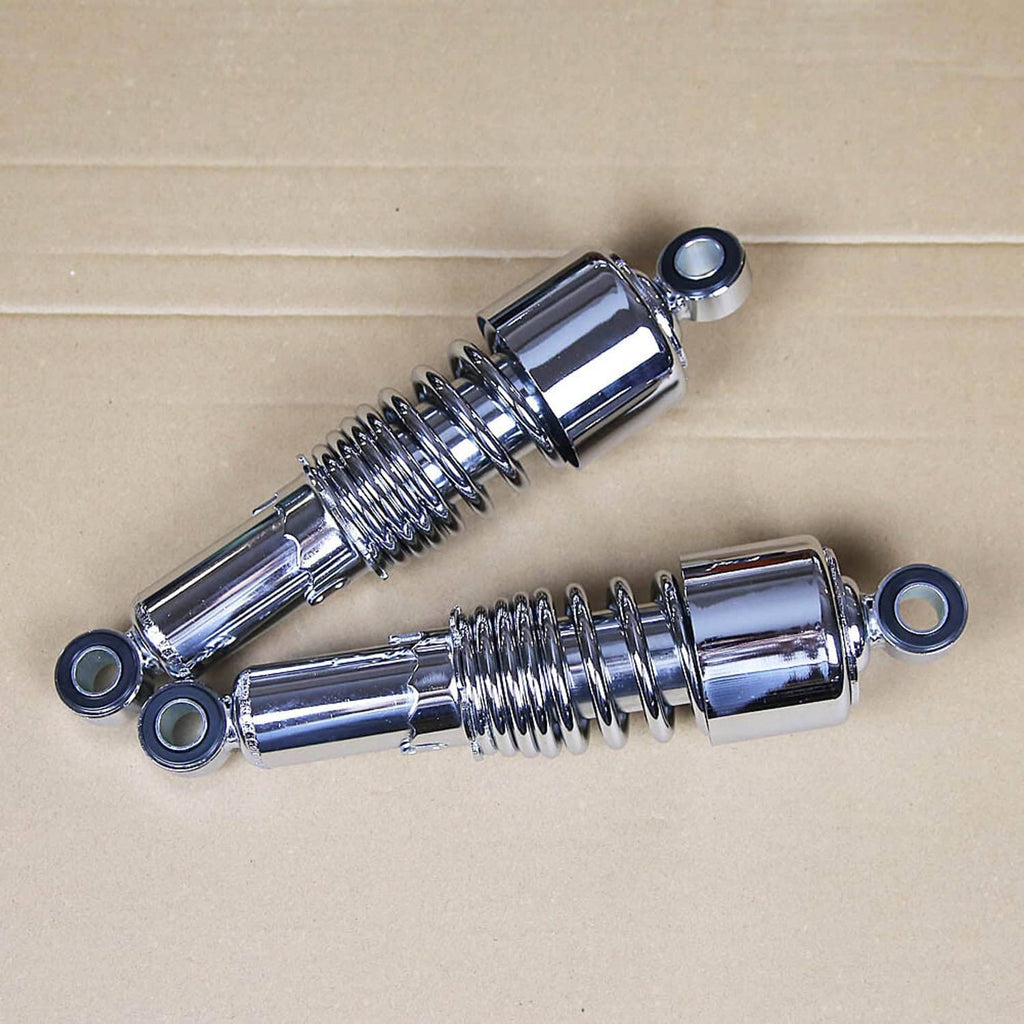 Pair of chrome rear shocks angled view, coiled springs and blue-ring mounting hardware
