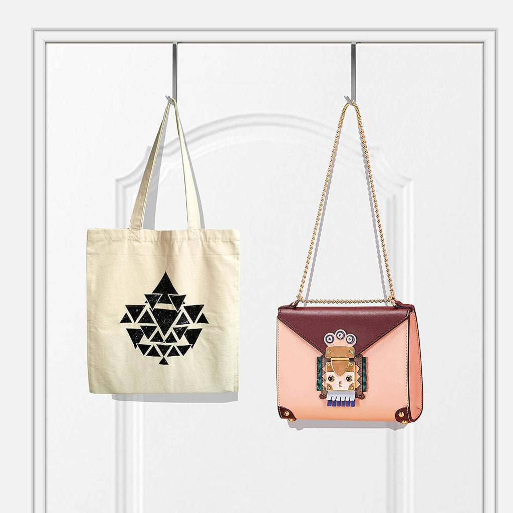 Over-the-door metal hook hangers holding a tote bag and a crossbody bag