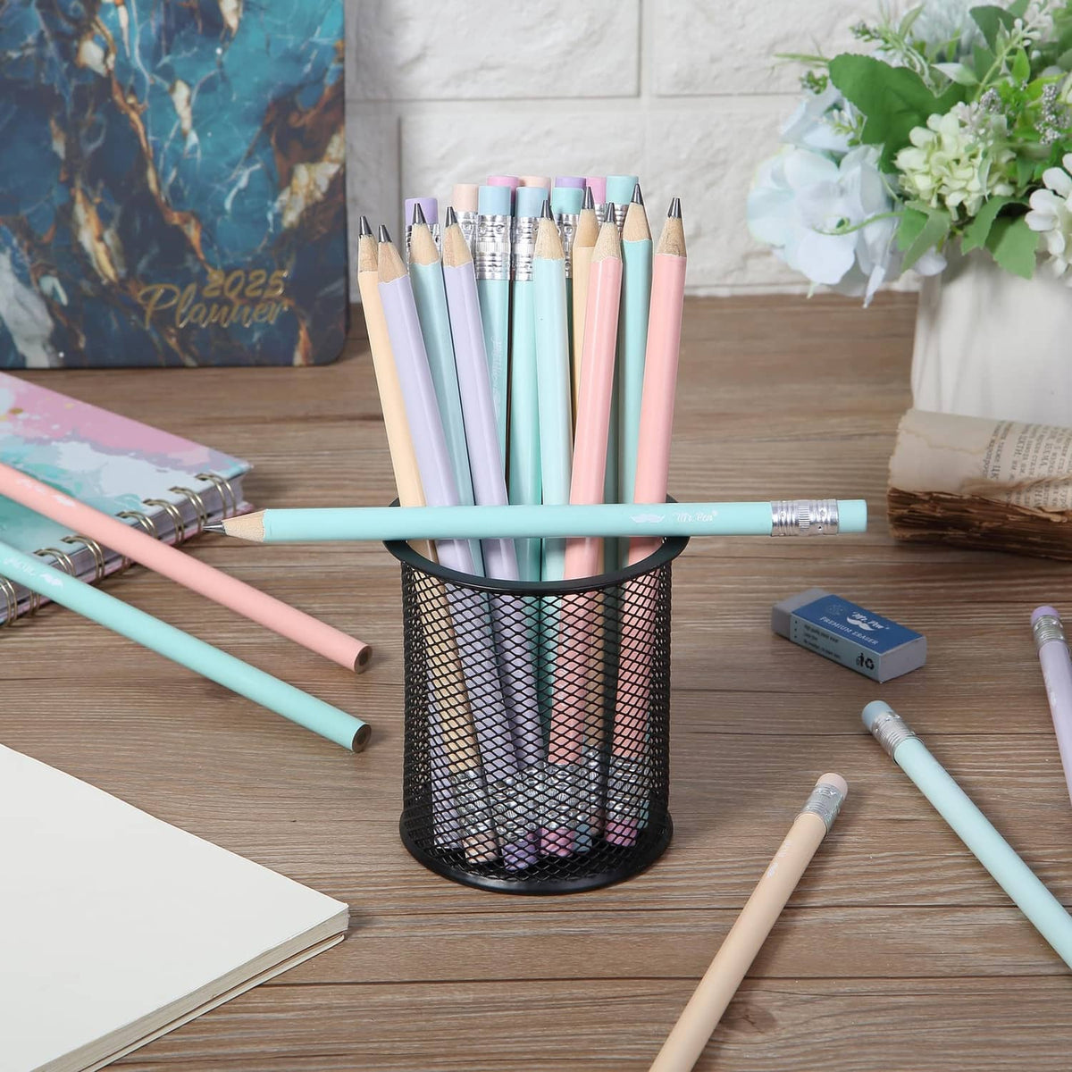 Pastel jumbo pencils standing upright with sharpened tips and colorful barrels