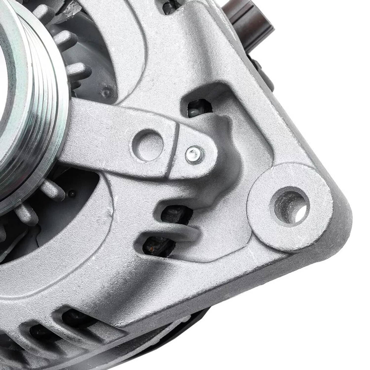 Alternator mounting ear with bolt hole and nearby bracket, close-up view