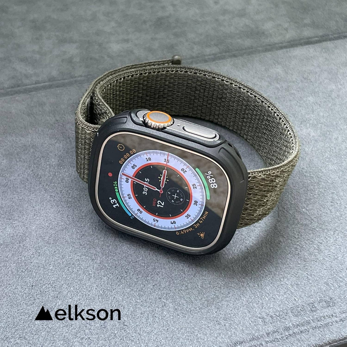 Dark gray Apple Watch Ultra bumper case with tempered glass, on woven fabric strap