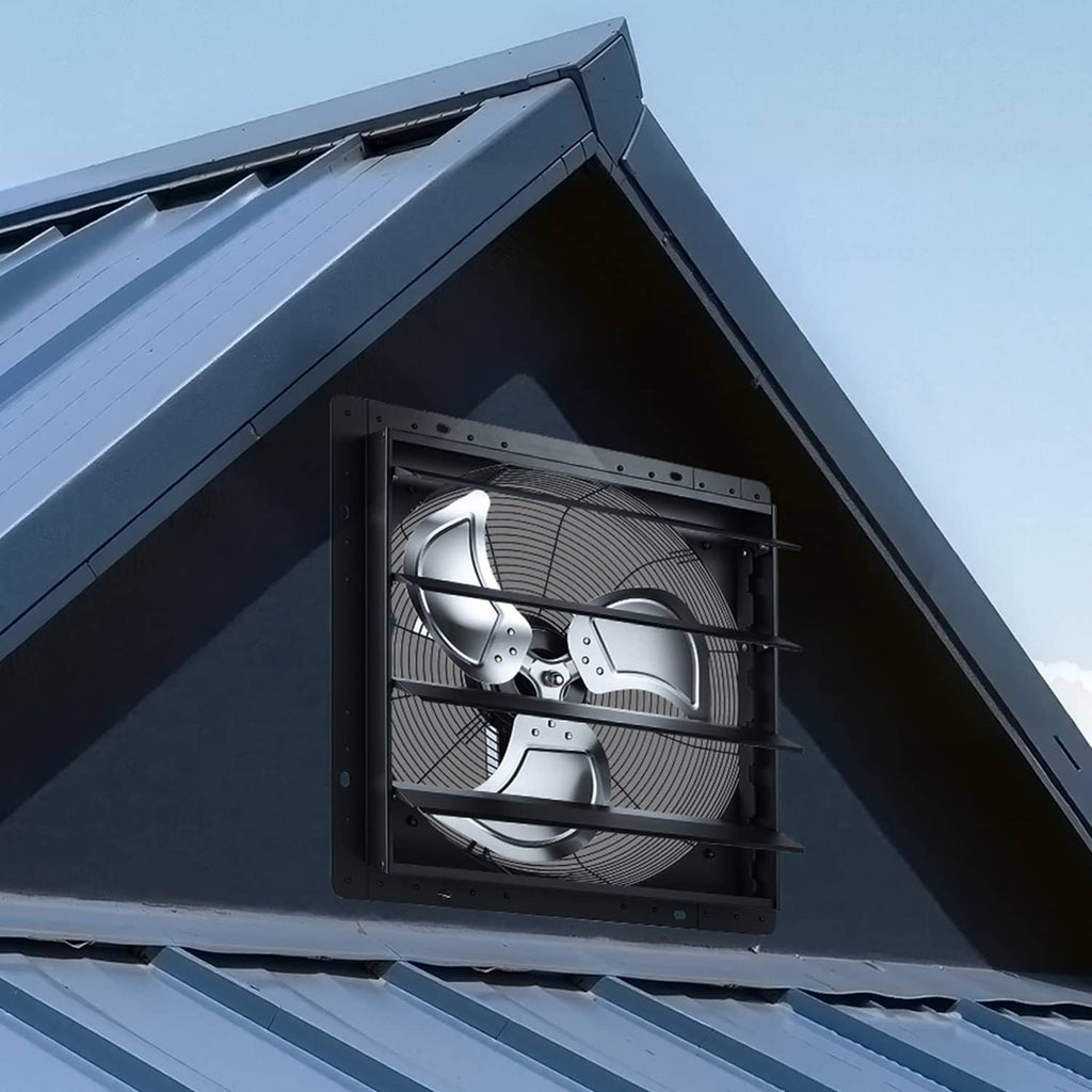 Wall-mounted shutter exhaust fan under eave with louvered grille, black housing
