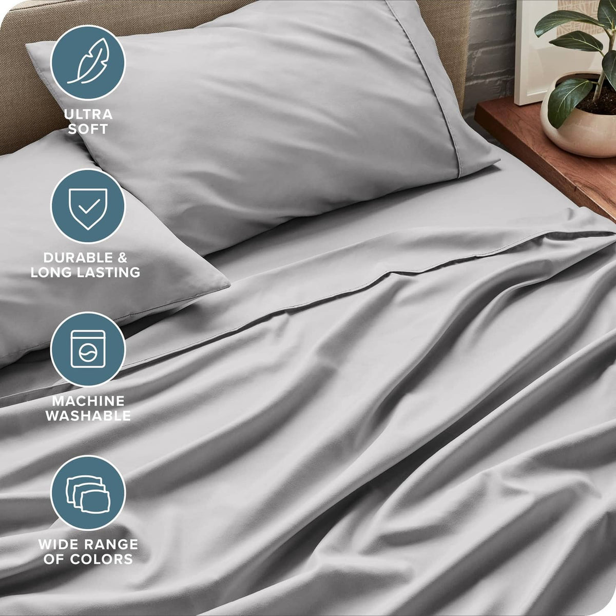 Light grey fitted and flat sheet set, showing smooth fabric and folded edges