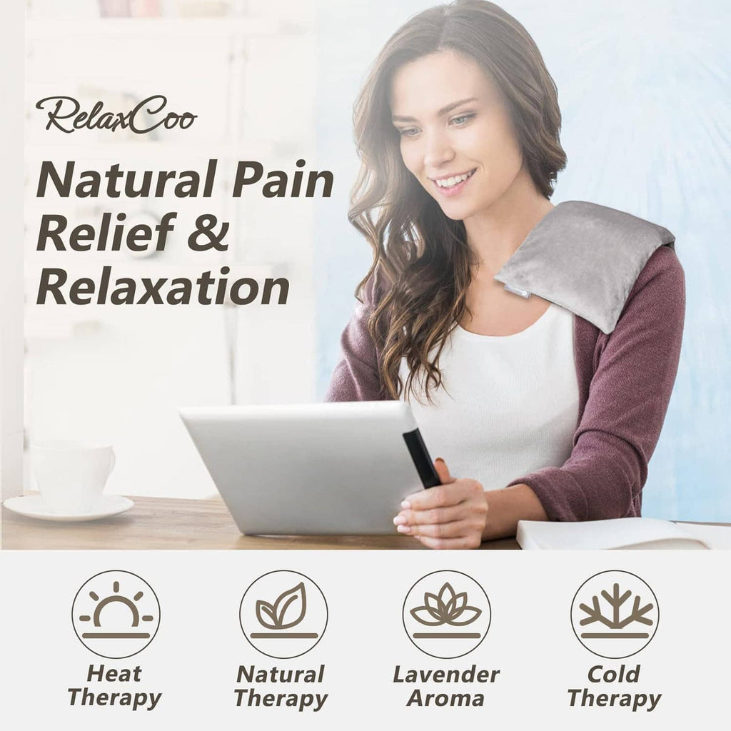 Grey microwavable heating pad resting on woman’s shoulders for warm therapy