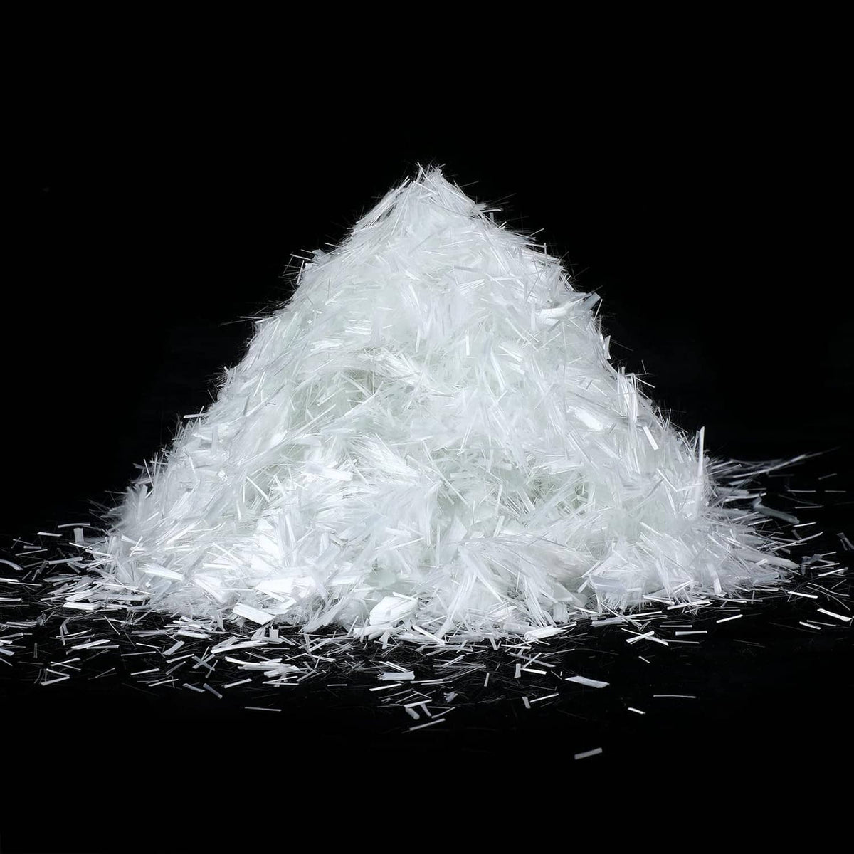 White fiberglass reinforcement strands mound with loose strands around it