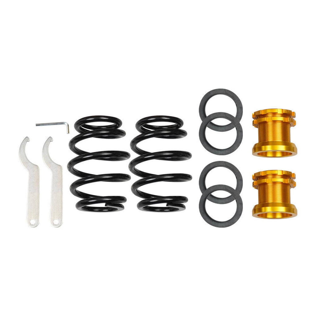 Coilover parts bundle: black coil springs, rubber spacers, and yellow adjustment sleeves
