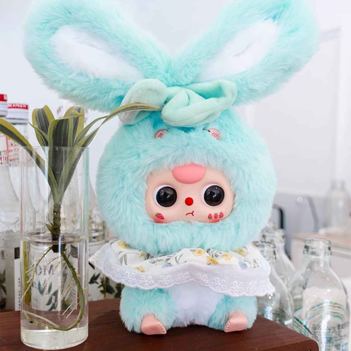 Light teal rabbit plush blind box figure with floppy ears and lace collar dress