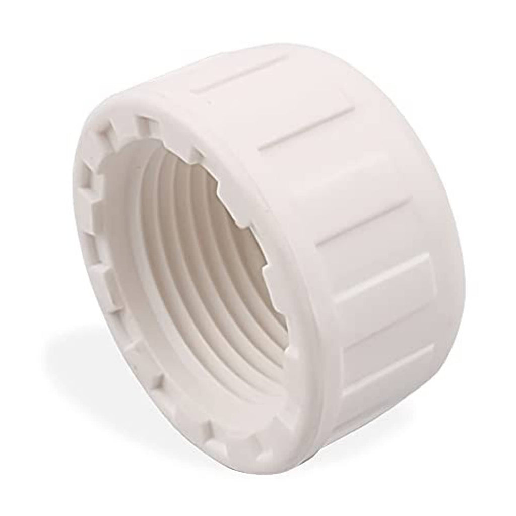 White PVC threaded pipe end cap, ridged sides and visible female thread opening