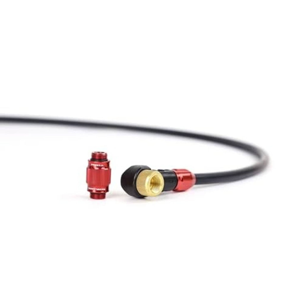 Red bicycle valve chuck with brass opening on a short black hose connector