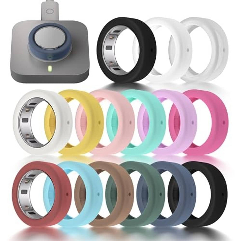 Assorted silicone ring covers in black, white, and pastel colors, neatly arranged for sizing.