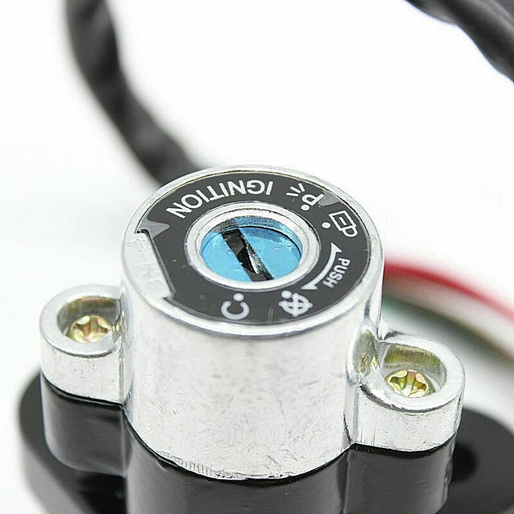 Ignition switch lock cylinder face with blue key slot and metal body, close-up