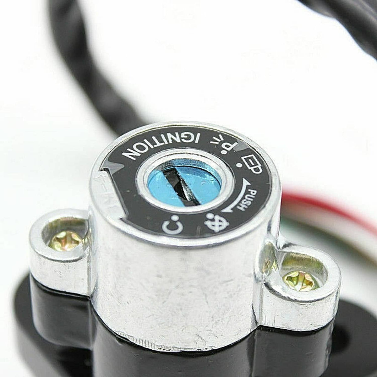 Ignition switch lock cylinder face with blue key slot and metal body, close-up
