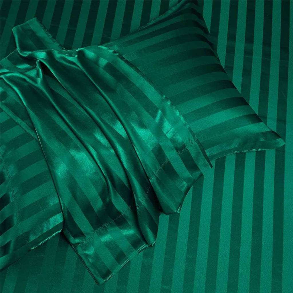 Teal green satin bedding close-up with horizontal stripes and gathered folds