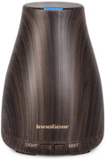 Brown ultrasonic essential oil diffuser with dark woodgrain finish and mist/light controls