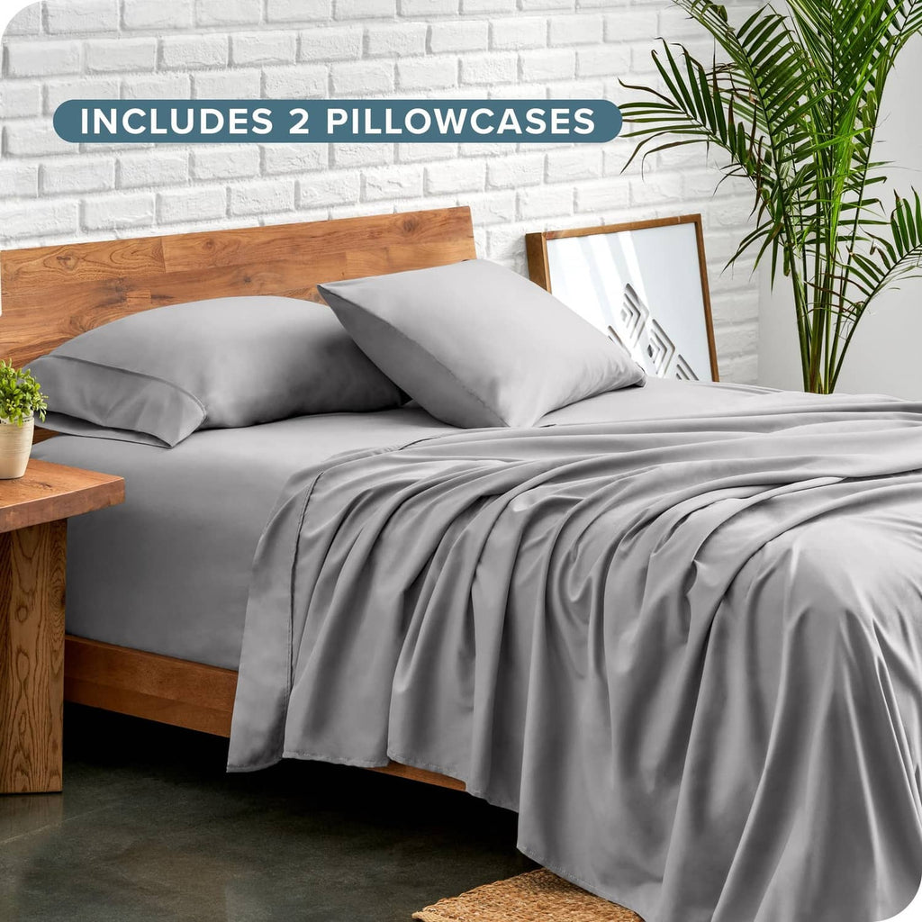 Light grey twin sheet set with two pillowcases and neatly laid flat sheet