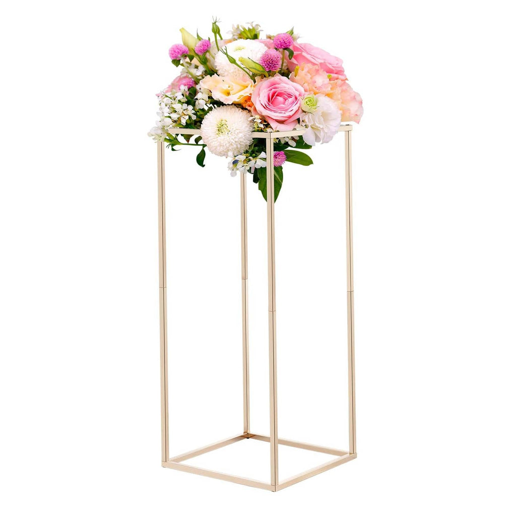 Gold flower stand with pink, white, and green bouquet on top shelf frame