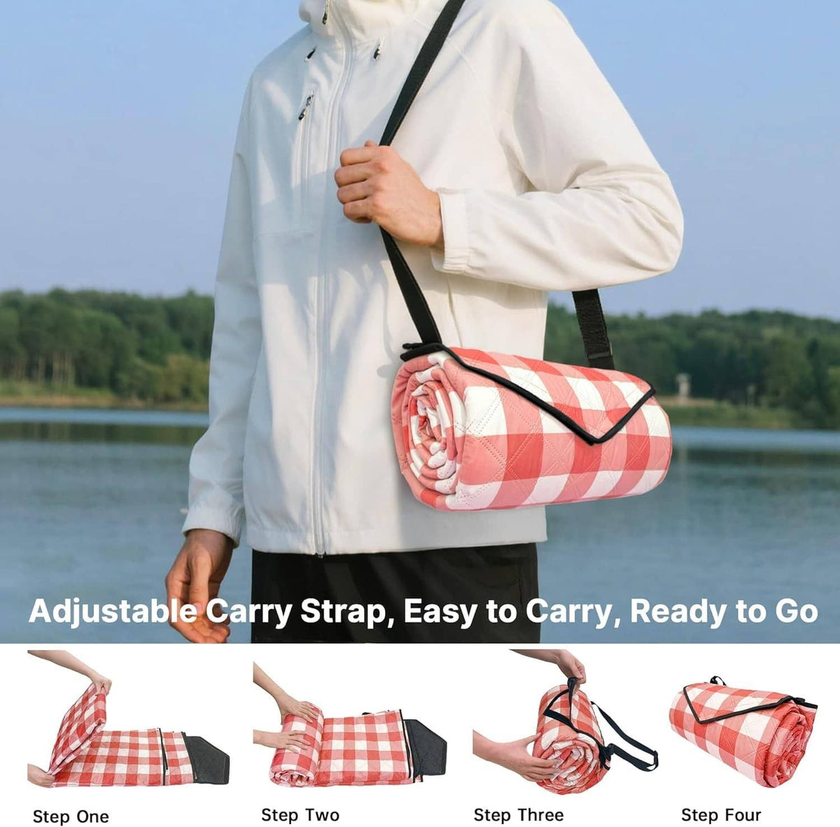 Red-and-white check picnic blanket rolled with adjustable shoulder carry strap
