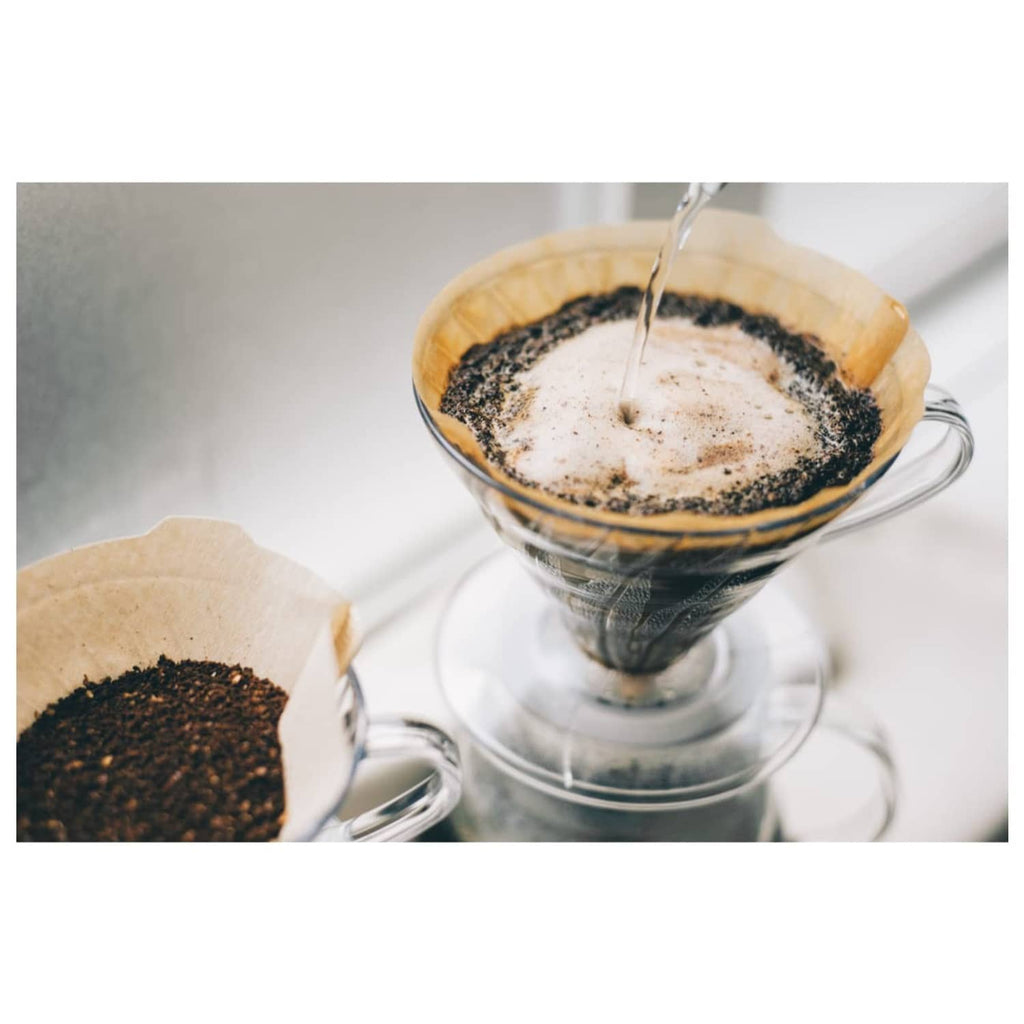 Brewed coffee in a dripper using a natural paper coffee filter
