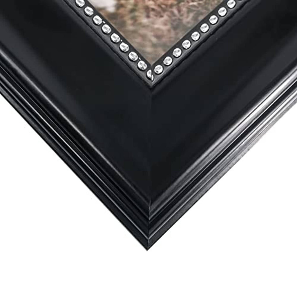 Black picture frame corner with silver rhinestone V-trim along the edge