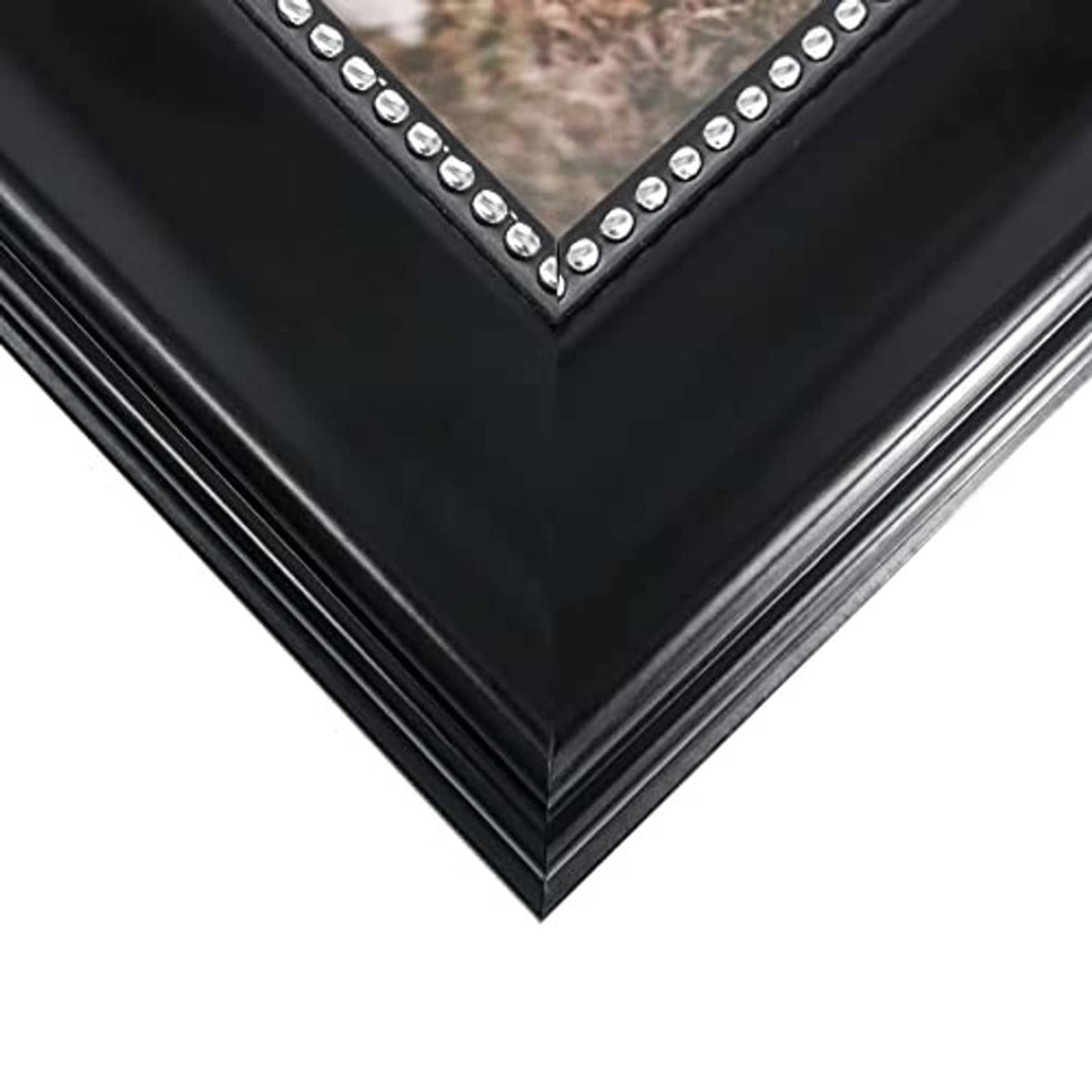 Black picture frame corner with silver rhinestone V-trim along the edge