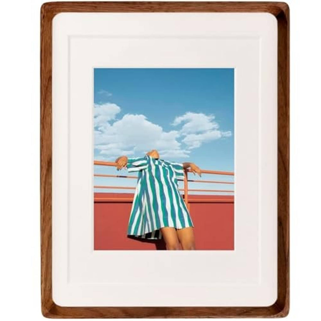 Walnut wood picture frame with white mat and single landscape photo, front view