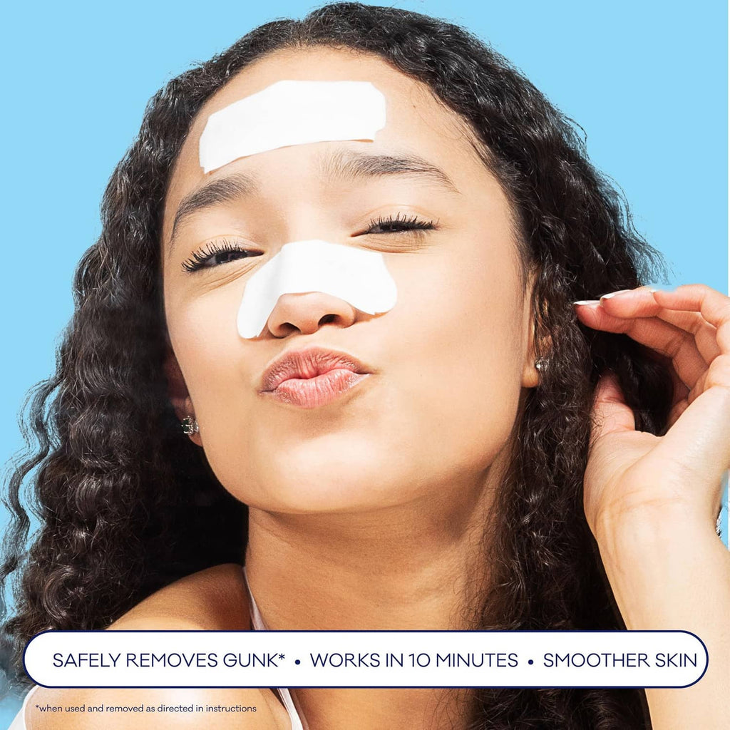 White pore strip applied on nose and upper face, shown on woman