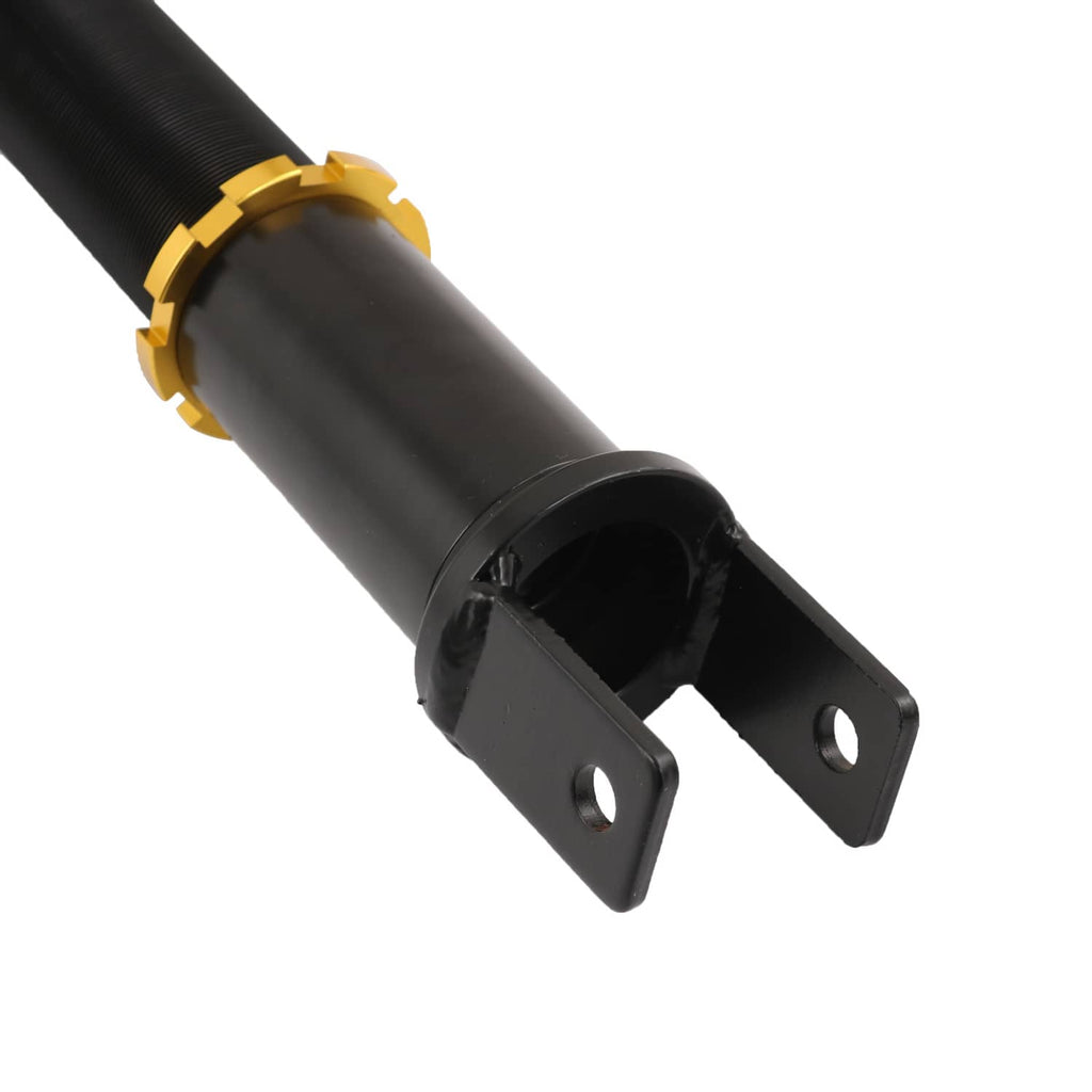 Close-up of black shock mount with gold adjustment collar and bolt holes