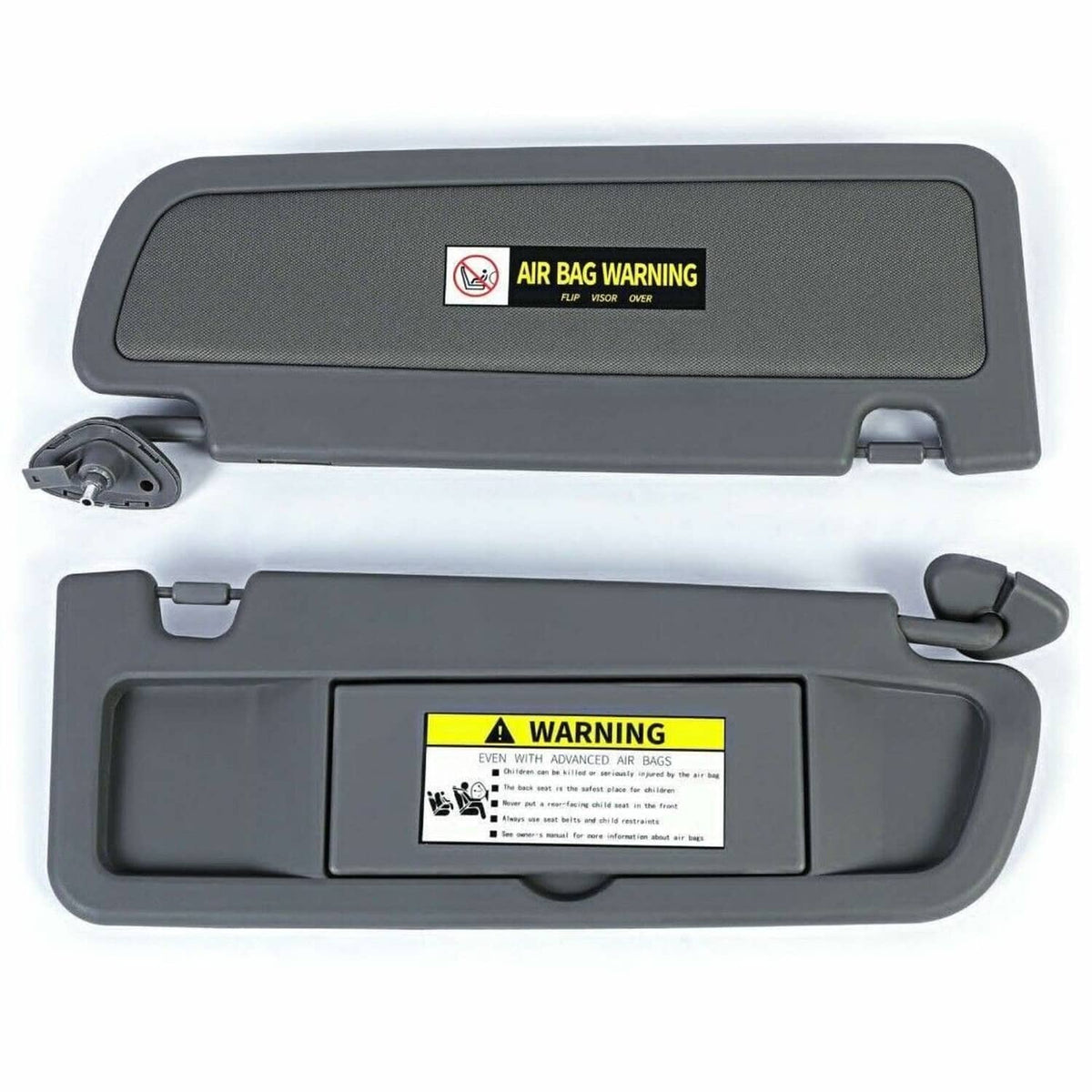 Pair of dark gray sun visors, front side view with air bag warning decals